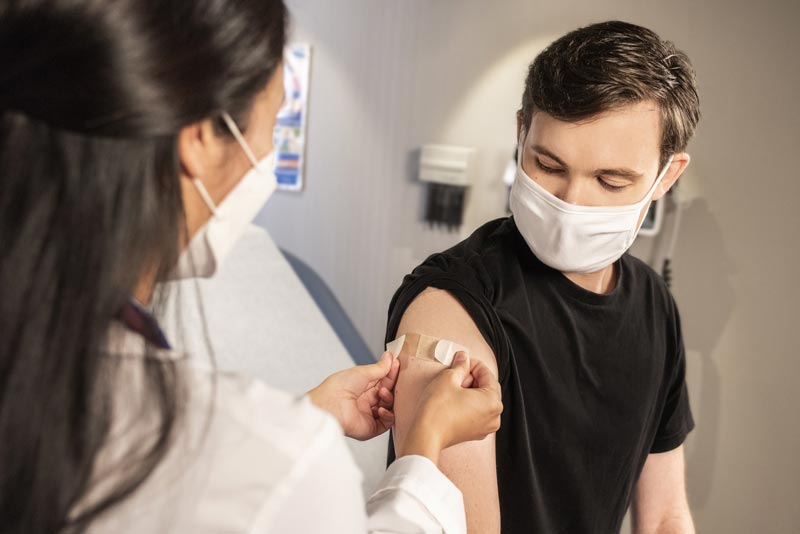 Young man getting COVID vaccine
